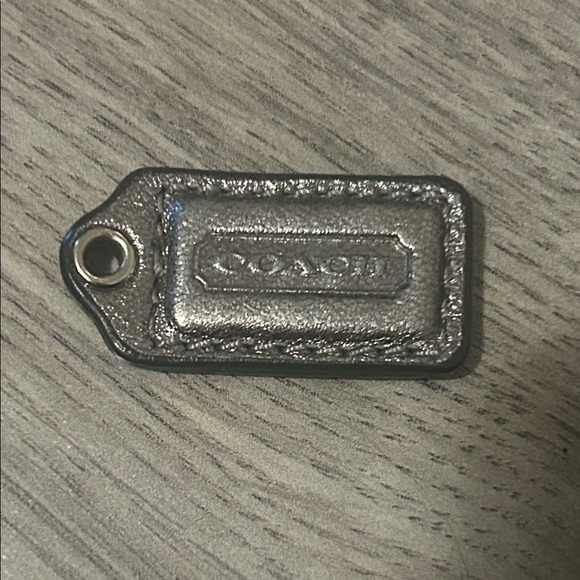 Coach Handbags - Coach Metallic Silver mini Leather Key Tag Charm